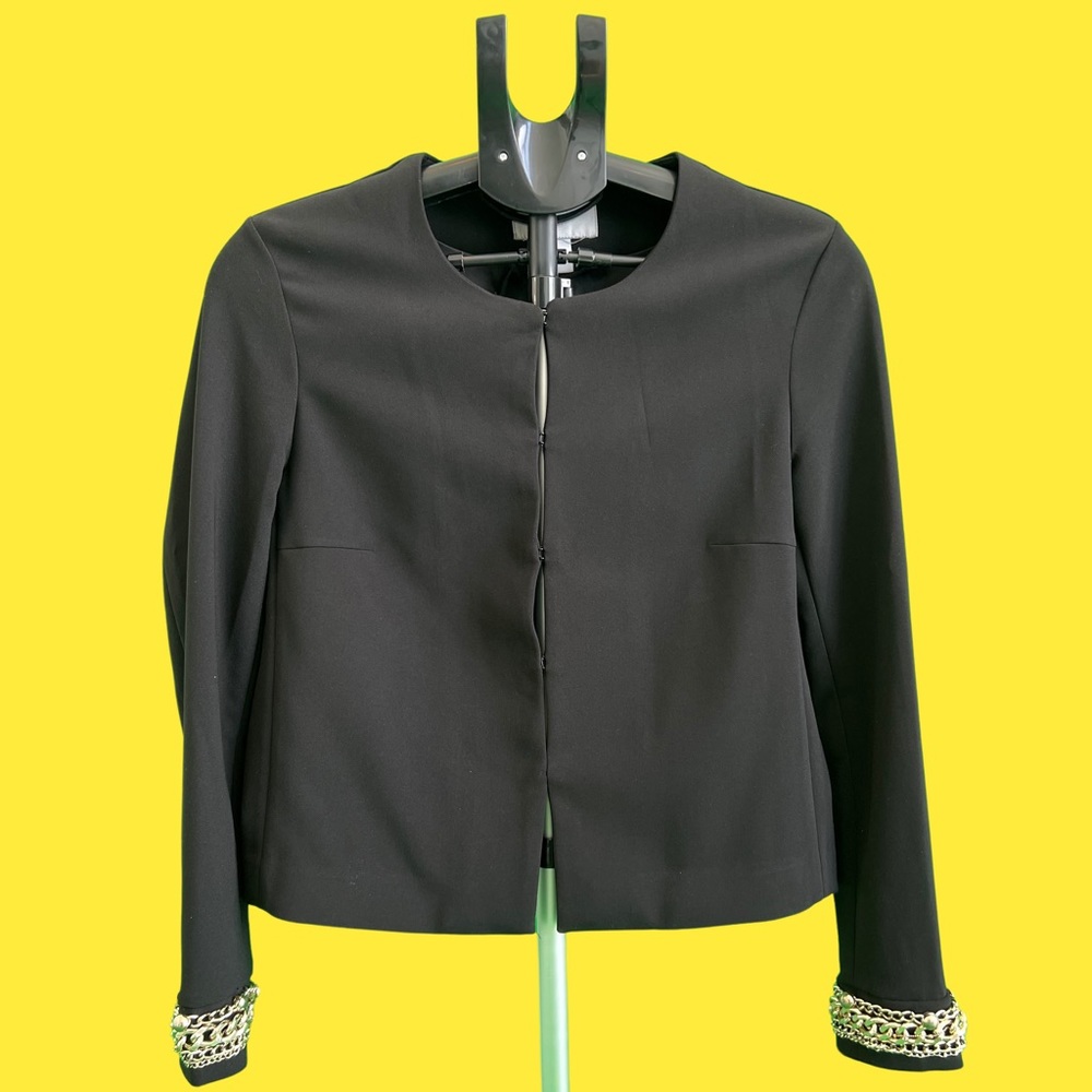 Black cardigan style blazer with metallic gold detail on the cuffs